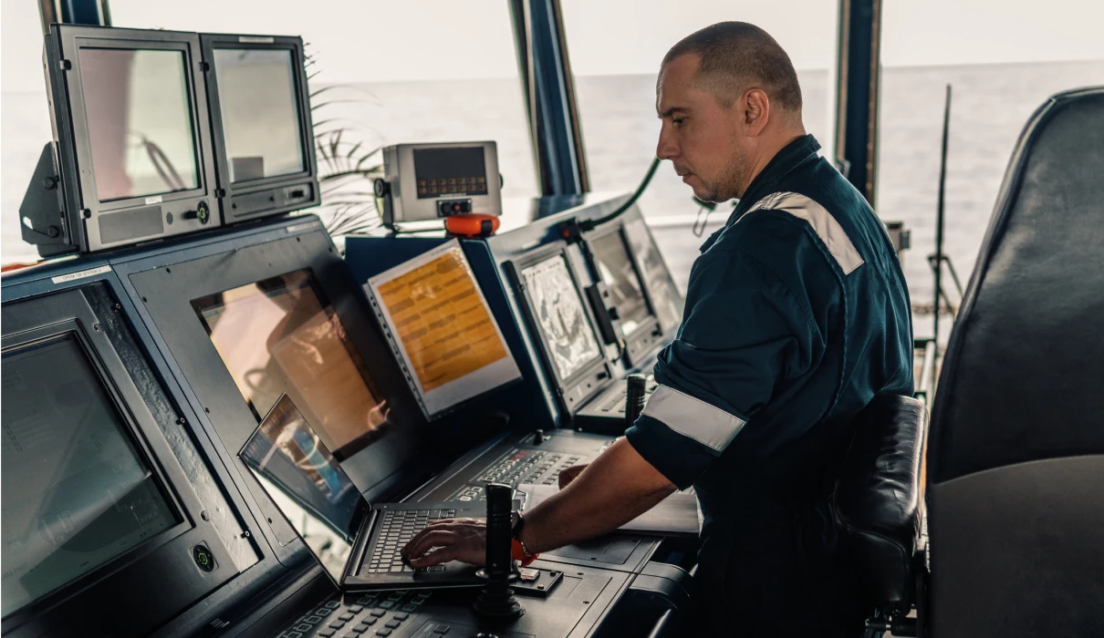 Man operating ship navigation equipment