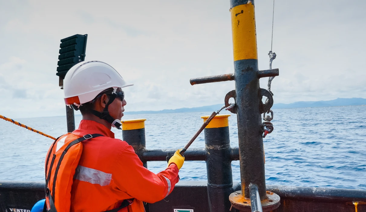 Person operating on offshore vessel deck